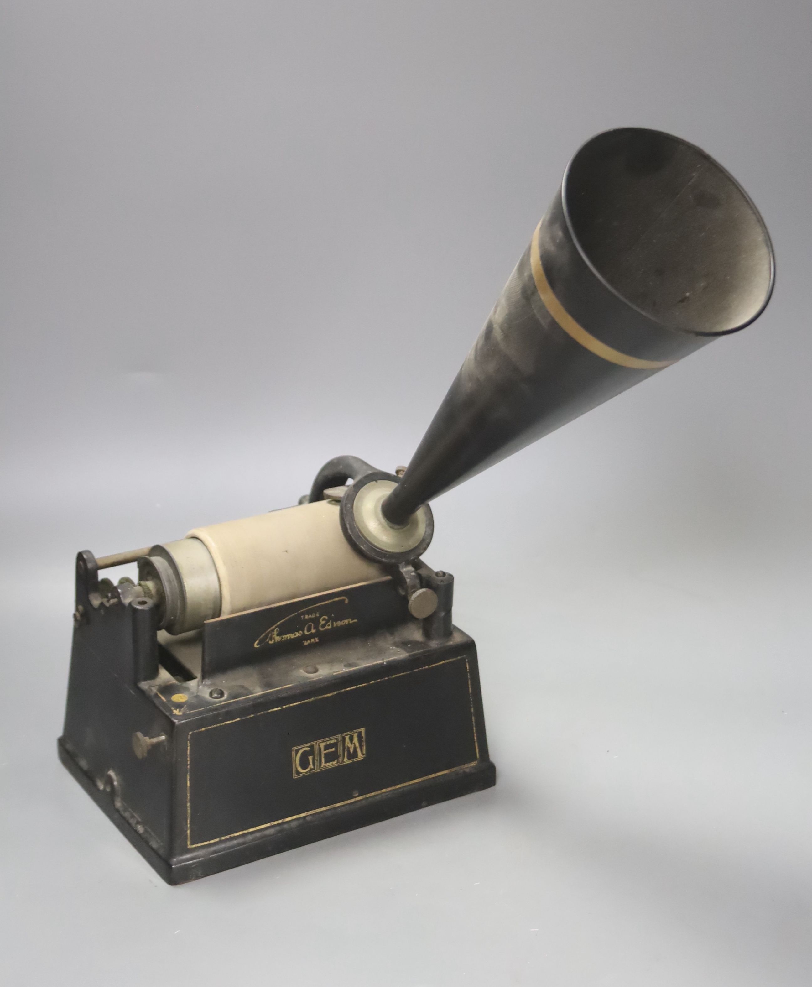 An Edison Gem phonograph, fitted with a horn, with original black and gilt bordered finish, 20cm wide, 15cm deep, 37cm high.